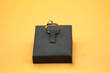 © christianjunior - ring in a box, Diamond ring in jewelry gift box on yellow background