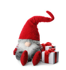 Poster - Funny Christmas gnome with gift boxes on white background