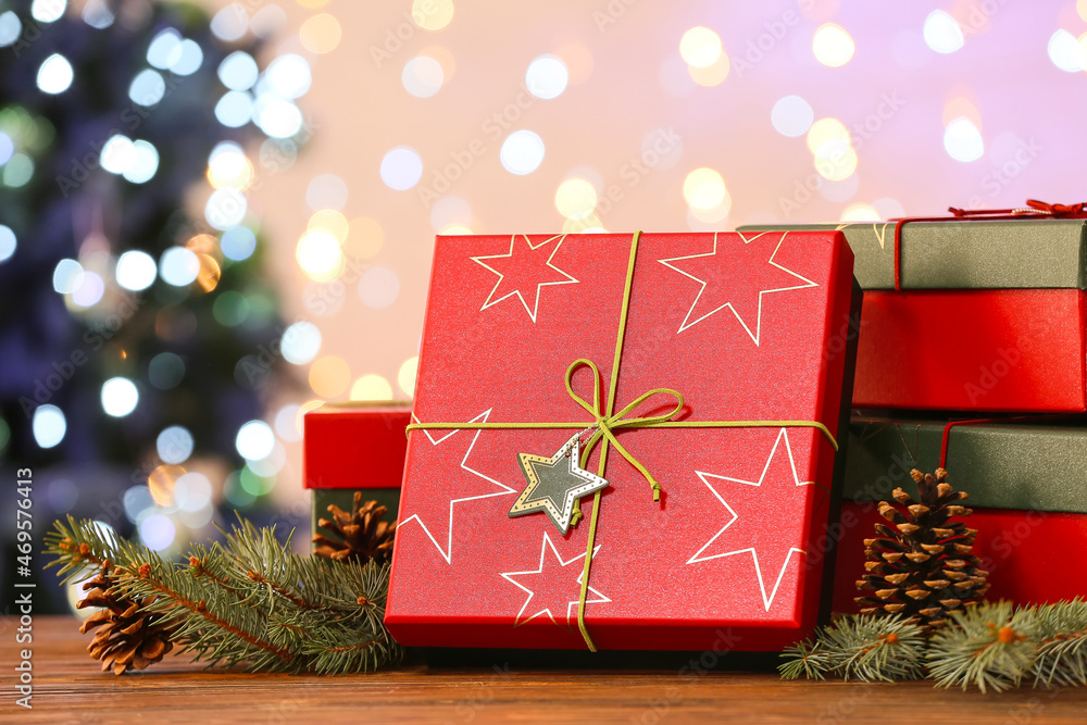 Christmas gift boxes on table against blurred background