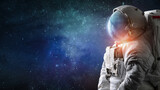 Fototapeta Kosmos - Astronaut in outer space. Spaceman with starry and galactic background. Sci-fi wallpaper. Elements of this image furnished by NASA