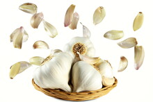  Garlic Bulb In Basket With Flying Or Falling Cloves Isolated 