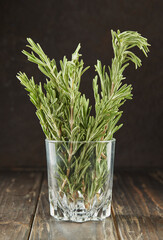 Canvas Print - Bouquet of fresh rosemary in glass, herbs to add to food