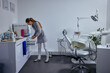 © bernardbodo - Caucasian female dentist working in her office
