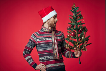 Wall Mural - emotional man in New Year's clothes decoration christmas studio posing