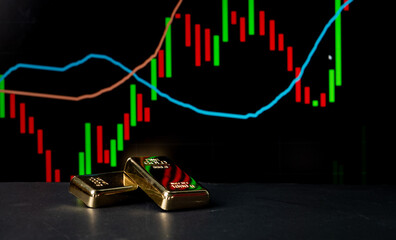 Selective focus on Gold Bars with up trend graph charts running in background by copy space - concept of Boom or bull run in Digital Gold market Shares.