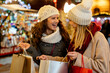 © NDABCREATIVITY - Portrait of cheerful young happy woman doing Christmas shopping. Christmas shopping people concept