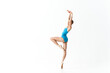 © SHOTPRIME STUDIO - woman in a blue leotard stands on one leg with her hands raised up ballerina dance model
