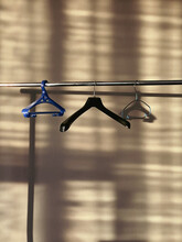 Empty Hangers In Empty Space, Emptiness And Desolation.