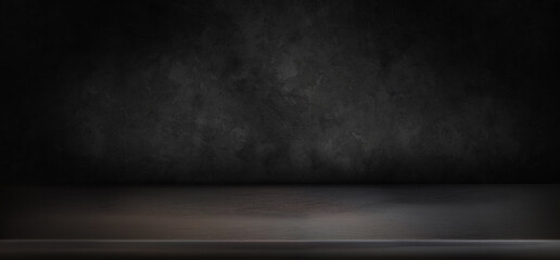 empty black table top with dark concrete rough background subtle lighting