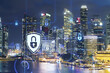 © VideoFlow - Glowing padlock hologram, night panoramic city view of Singapore, Asia. The concept of cyber security to protect companies. Double exposure.