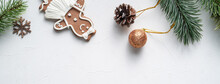 Decorated Christmas Gingerbread Cookies With Decorations On White Table Background.