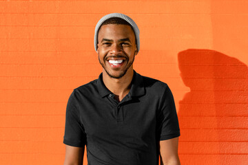 Teen boy portrait, African Amercian with bright wall background