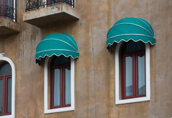 Wall Mural - wet green awning over the window. green canvas roof in rainy season.