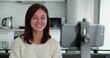 © ann_80988321501 - Woman record videovlog using smart phone sitting on couch alone in living room, put device on tripod female film new vlog make on-line live stream, lead webinar distant chat, modern tech video event