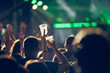 © astrosystem - Person holding cold beer plastic cup on a music festival.