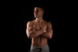 © Alex - Sportsman Hands Crossed Topless Smiling. Healthy Life, Medical protection, Sports Concept. Looking to Side