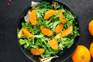 tangerine salad leaves green mix fresh citrus meal snack on the table copy space food background rustic. top view keto or paleo diet veggie vegan or vegetarian food no meat