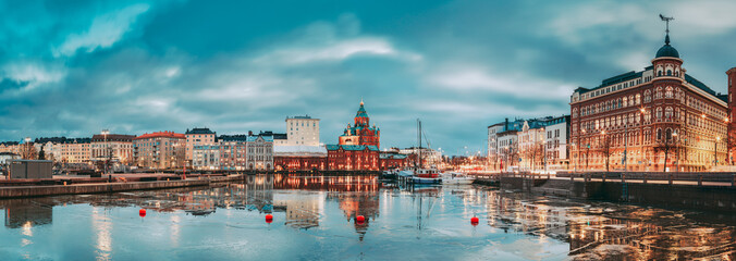 Wall Mural - Helsinki, Finland. Panoramic View Of Pier, Embankment On Kanavaranta Street, Uspenski Cathedral And Pohjoisranta Street In Evening Illuminations