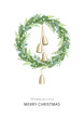 Christmas wreath with greenery, berries and golden bells hanging on rustic rope. Festive decoration in Scandinavian style. Greeting card.