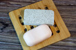 © Lili-OK - A bar of soap and a pumice stone. Bath accessories, top view. Daily body care concept, organic bath products.