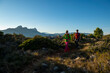© Cavan Images - Couple hiking on Oltá mountain, Calpe, Alicante, Spain