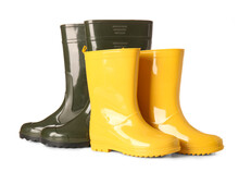 Different Rubber Rain Boots On White Background