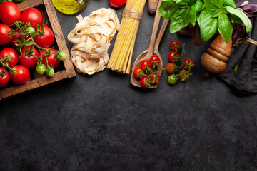 Wall Mural - Italian cuisine food ingredients. Pasta, tomatoes, basil and spices