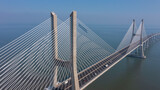 Aerial view of the most beautiful Portuguese bridge in Lisbon, Vasco da Gama. Morning foggy seascape.