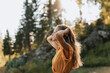 © Johnér - Smiling young woman touching hair