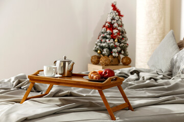 Wall Mural - Christmas breakfast in bed on a beautiful morning and sunshine 