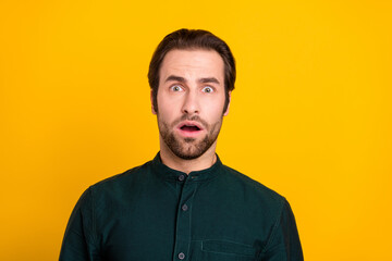 Canvas Print - Photo of fear millennial guy open mouth wear green shirt isolated on yellow color background