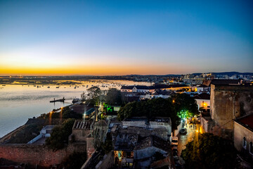 Wall Mural - Faro cityscape by sunset - historic architecture and Ria Formosa, Portugal