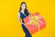 © siraphol - Portrait beautiful young asian woman smile with red gift box
