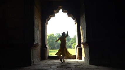 Wall Mural - Silhouette of Indian girl performing classical dance, India