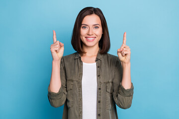 Wall Mural - photo of promoter lady point hands up empty space present ads promo wear khaki clothes isolated over