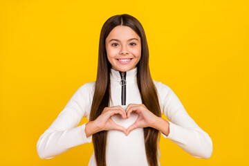 Sticker - Photo of shiny charming student girl wear white zip shirt smiling showing hands arms heart isolated yellow color background