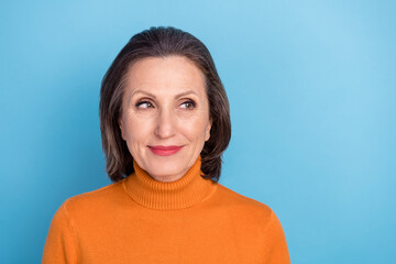 Poster - Photo of pretty positive minded person look empty space dream dreamy isolated on blue color background