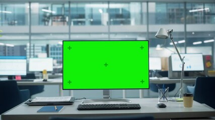 Aufkleber - Desktop Computer Monitor with Mock Up Green Screen Chroma Key Display Standing on the Desk in the Modern Business Office. In the Background Glass Wall with Big City Office. Zoom in Shot.