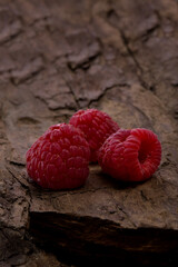 Wall Mural - Fresh raspberry in a wooden plate