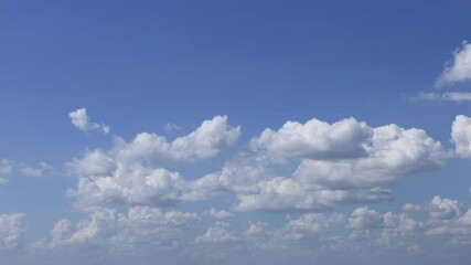 Wall Mural - Blue sky and white clouds. The fluffy cloud moves in the blue sky
