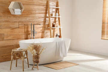 Sticker - Bathroom interior with white tub and decor near wooden wall