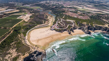  Aerial view panorama of the village and Odeceixe beach, in summer in the Algarve. Portugal 