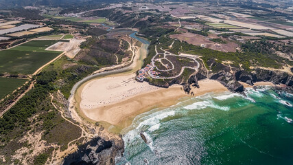 Canvas Print -  Aerial view panorama of the village and Odeceixe beach, in summer in the Algarve. Portugal 