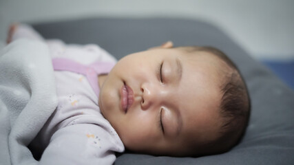 Wall Mural - cute baby fall asleep at night