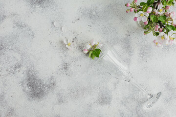 Place table setting with blossoming apple tree branches and flowers