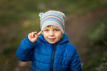 Portrait Of Blonde Little Boy With Blue Eyes And Blue Jacket Sal