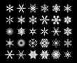 A collection Of Silver Snowflakes On A Black Background