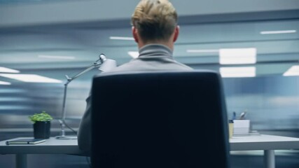 Poster - 360 Degree Modern Office: Handsome Businessman Sitting at His Desk Working on a Laptop Computer. Man working with Big Data e-Commerce Analysis. Energetic Fast Tracking Shot. Camera Moving Around