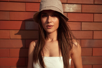 Wall Mural - Young casual lady in bucket hat