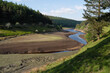 Low water at Howden Reservoir in the Peak District, National Park, Derbyshire England, Landscape during a dry summer